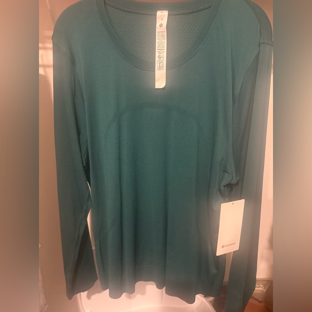 Lululemon SWIFTLY relaxed long sleeve hip length size 12 women’s new with tag!!